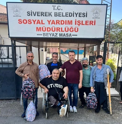 SİVEREK'TE ANLAMLI HEDİYE ENGELLİ BİREYLERİN  ÇOCUKLARINA OKUL ÇANTASI YARDIMI